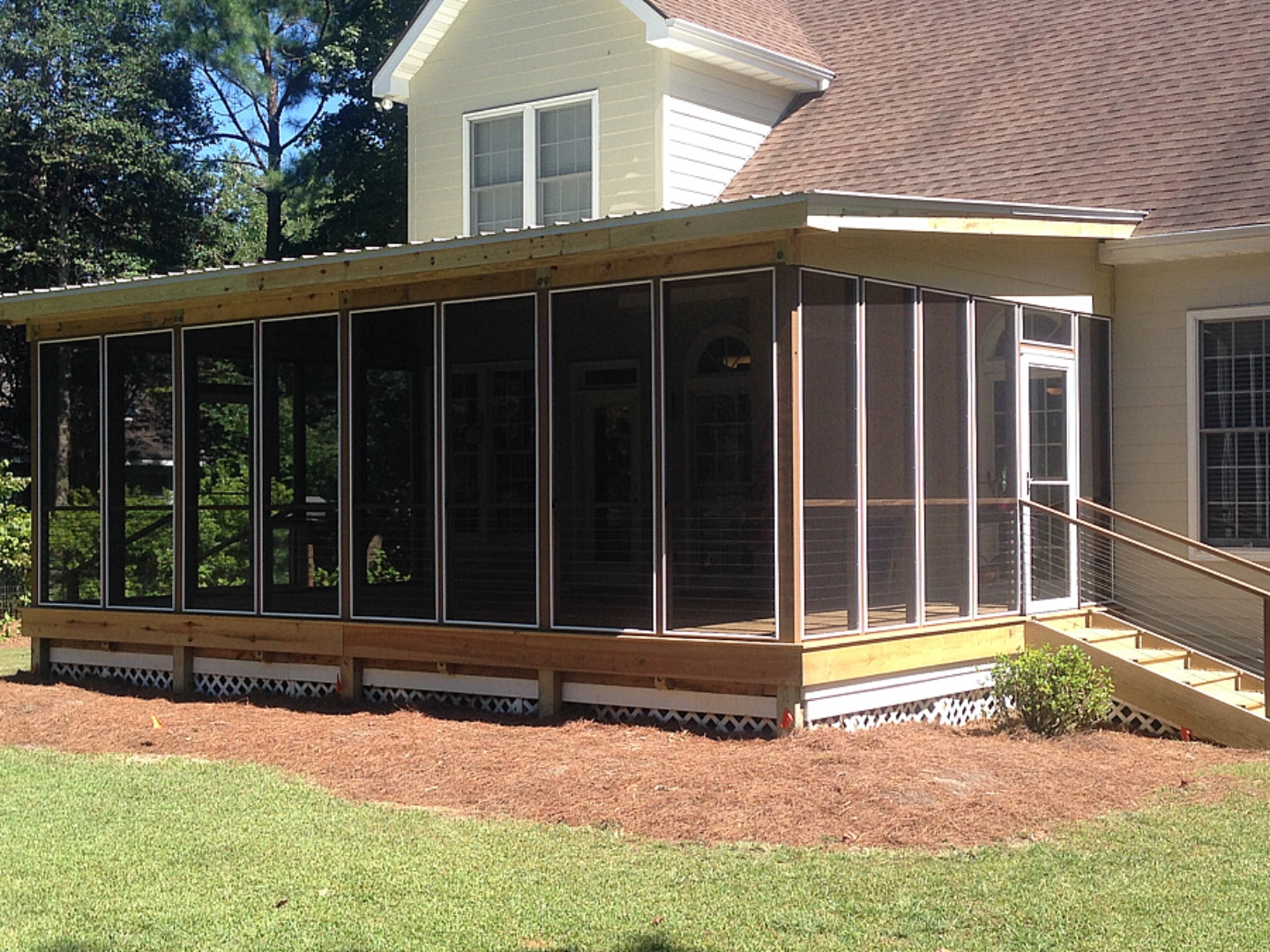 Screened porch with seating area