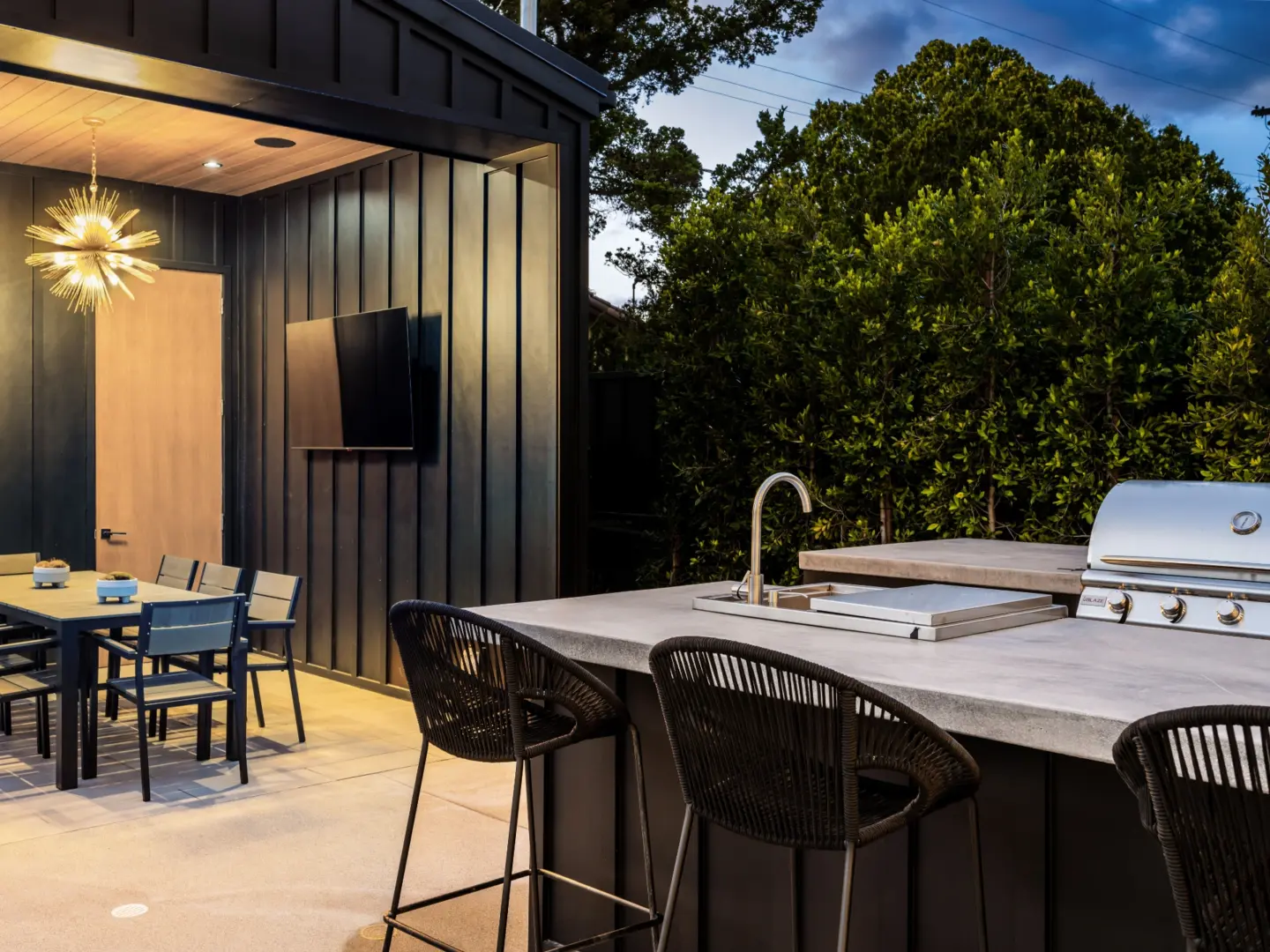 Stock Modern outdoor kitchen and dining area
