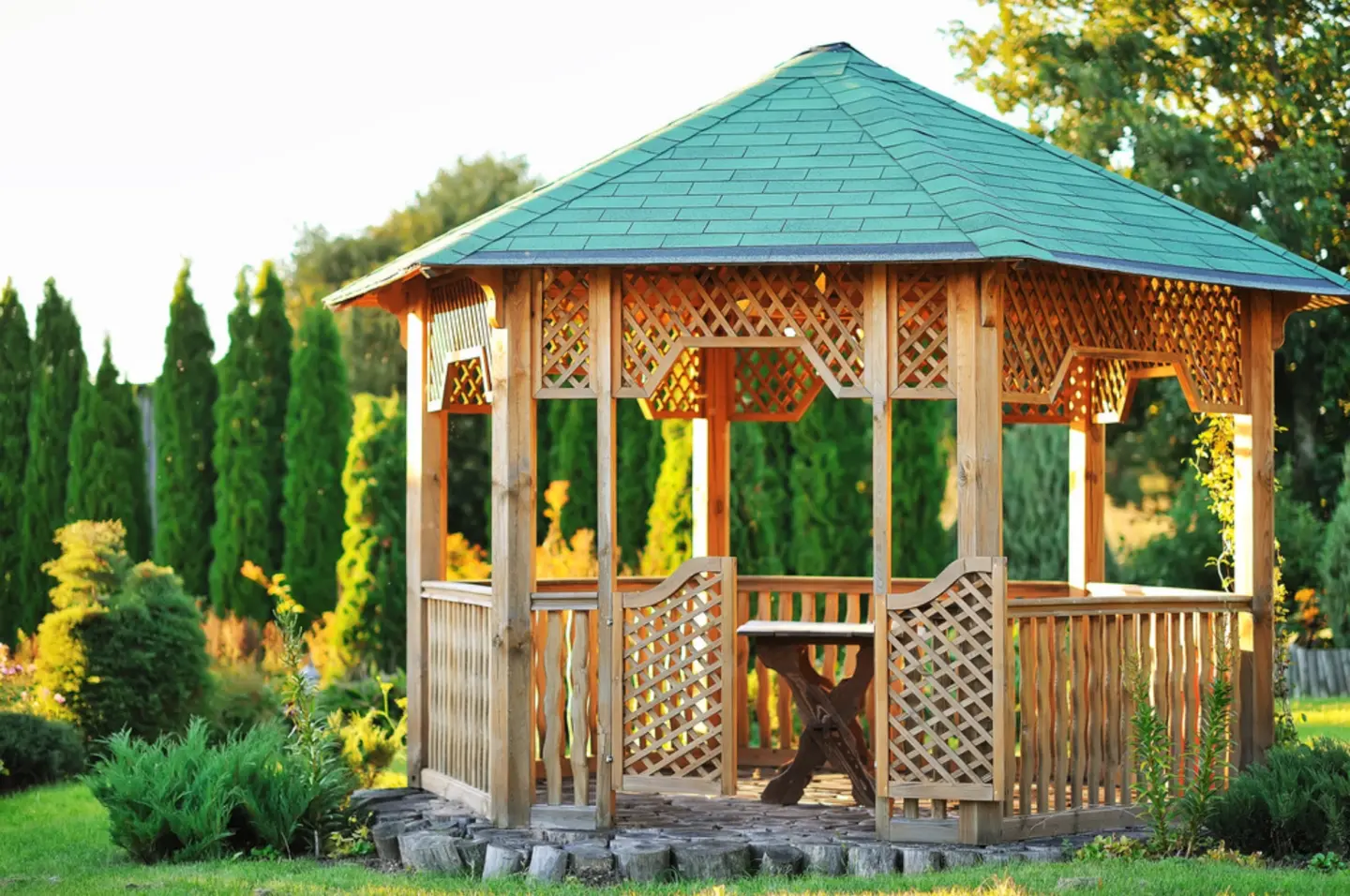 Stock outdoor wooden gazebo over summer landscape background